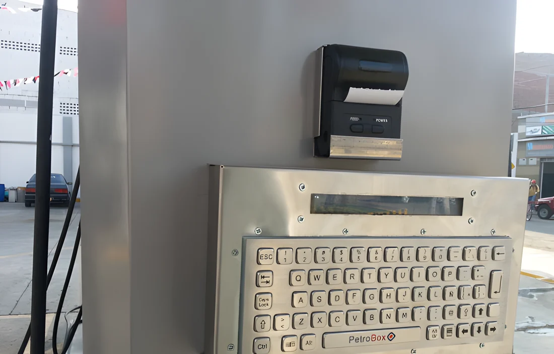 PetroBox Term installed on the dispenser, with metal keypad and printer